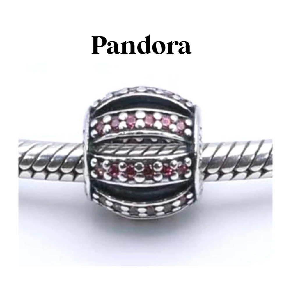 PANDORA Sterling SilverOpenwork silver charm with pave pink cubic zircon…